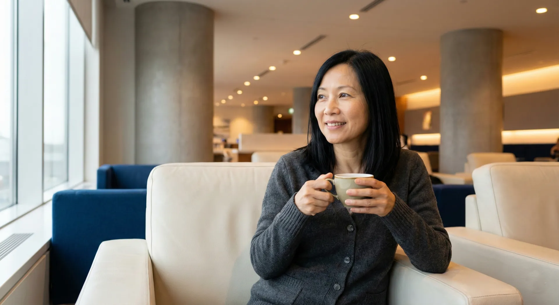 Woman finding calm at airport lounge before flight